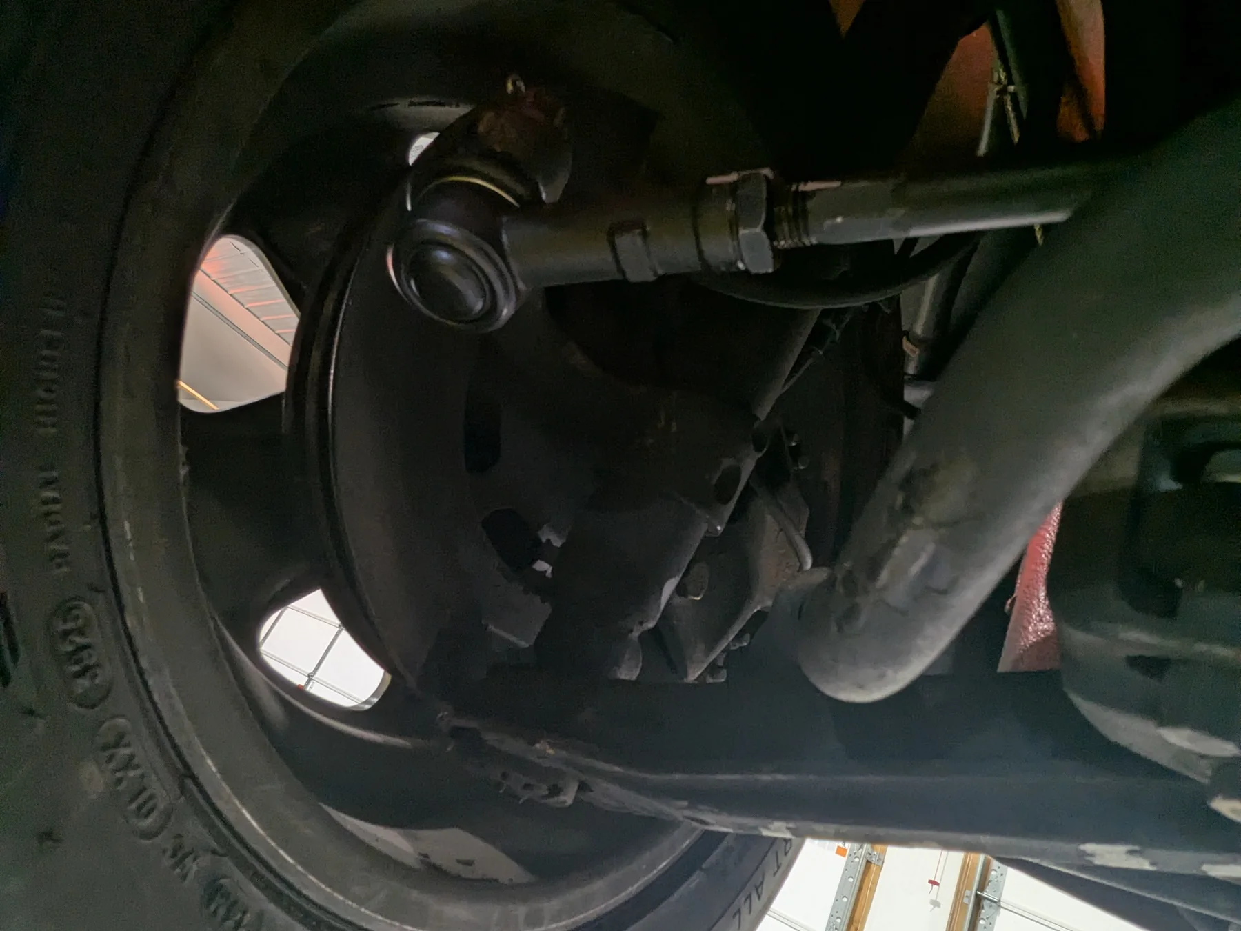 Before dry ice cleaning: wheel-well, suspension, and control-arm detail of the 1988 Porsche 911