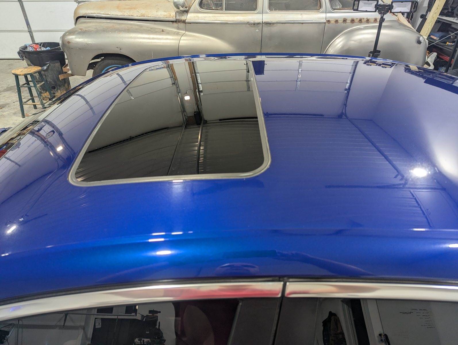 After paint polishing blue Cadillac ATS roof with improved gloss